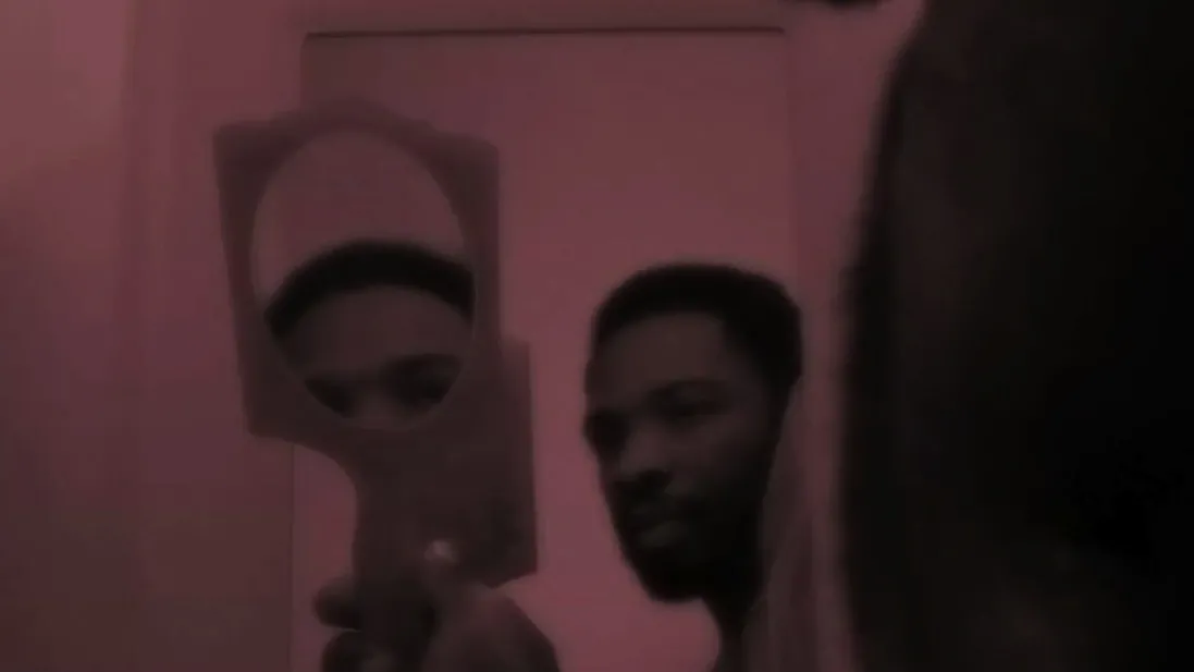 A person holding a mirror.